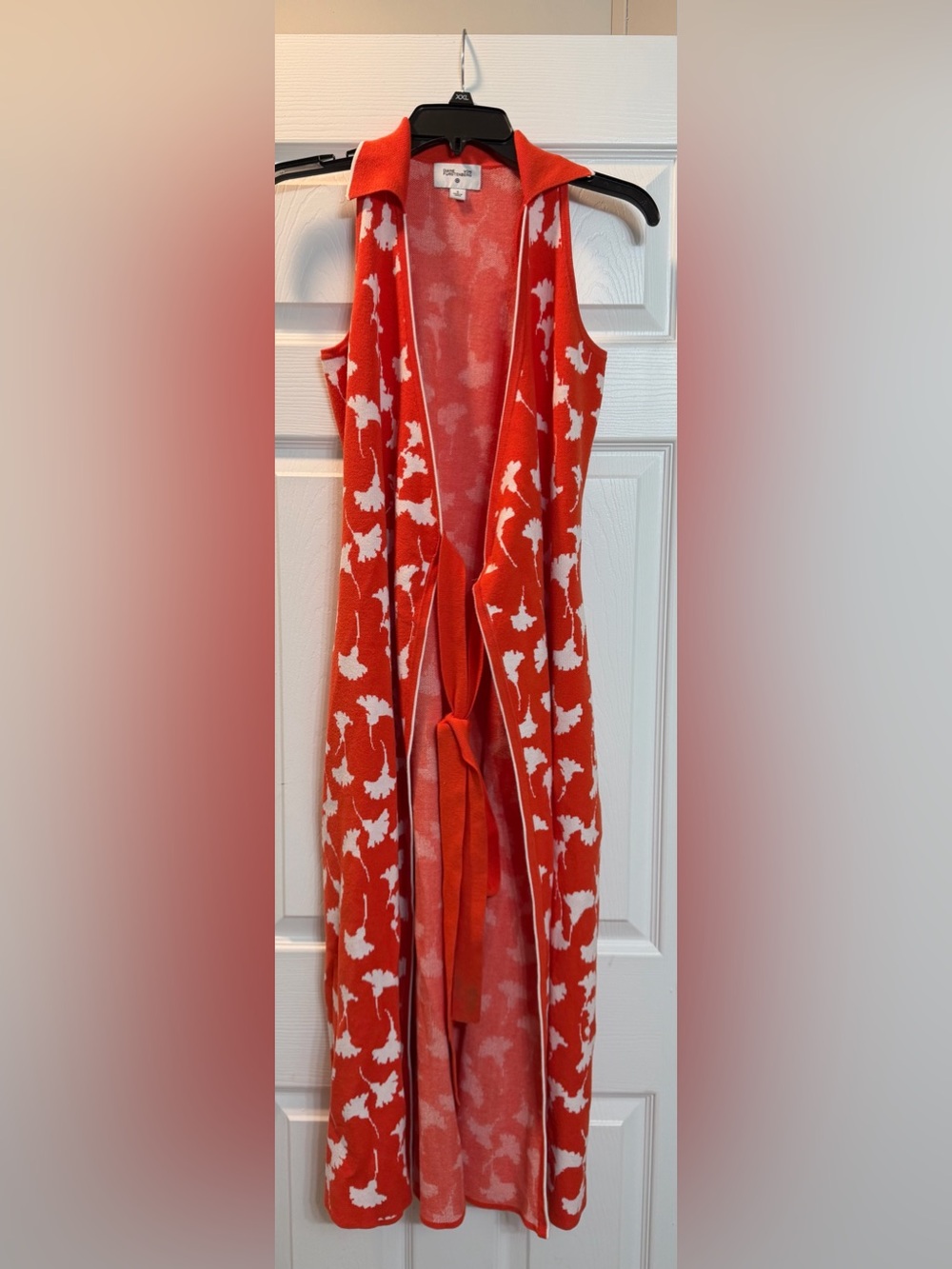 Diane Von Furstenberg or age and white floral wrap dress